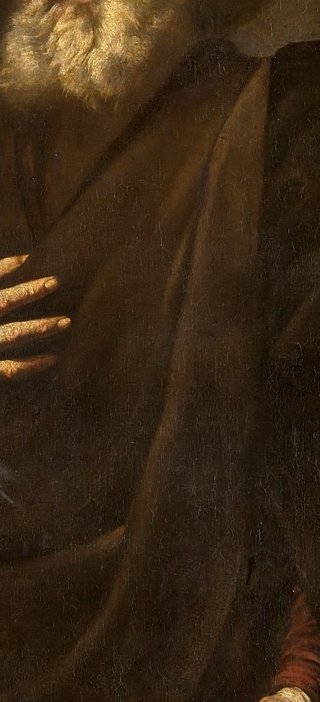 He holds his cross, the symbol of his martyrdom.