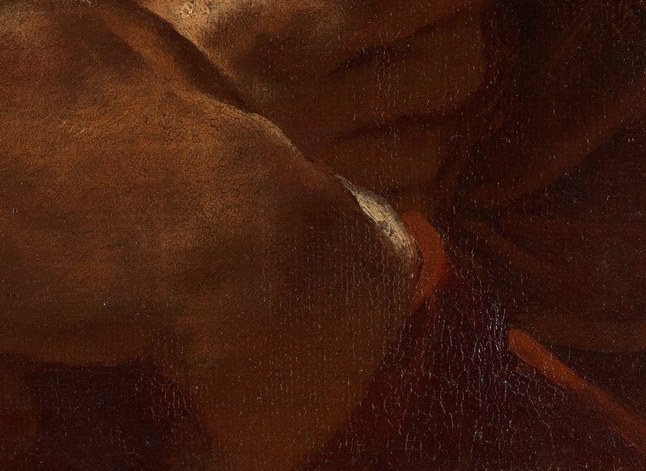 His hands are tightly clenched, holding a white cloth.