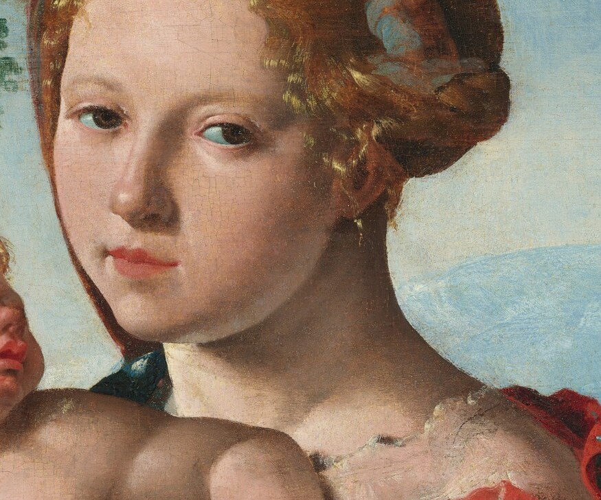 The Virgin Mary rests, cradling her child on their journey.