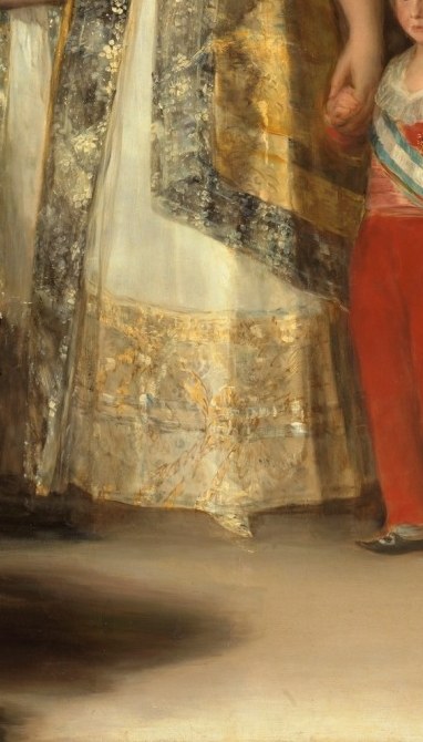 Likely the future Ferdinand VII; the saturated red pulls every eye to the succession question at the compositional heart of the painting