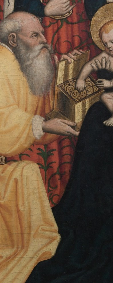The kneeling king offers a golden vessel to the Christ Child.