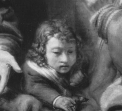 A boy watches the unfolding drama.
