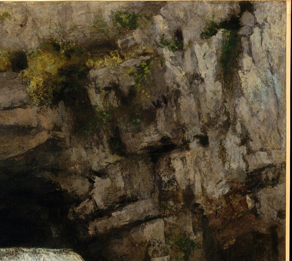 Look at the textured cliff face.