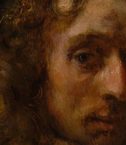 The loose, tousled curls add a touch of informality and realism, contrasting with the formality of his attire.