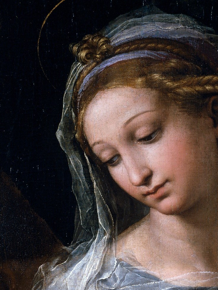 Look at the Madonna's downcast face.