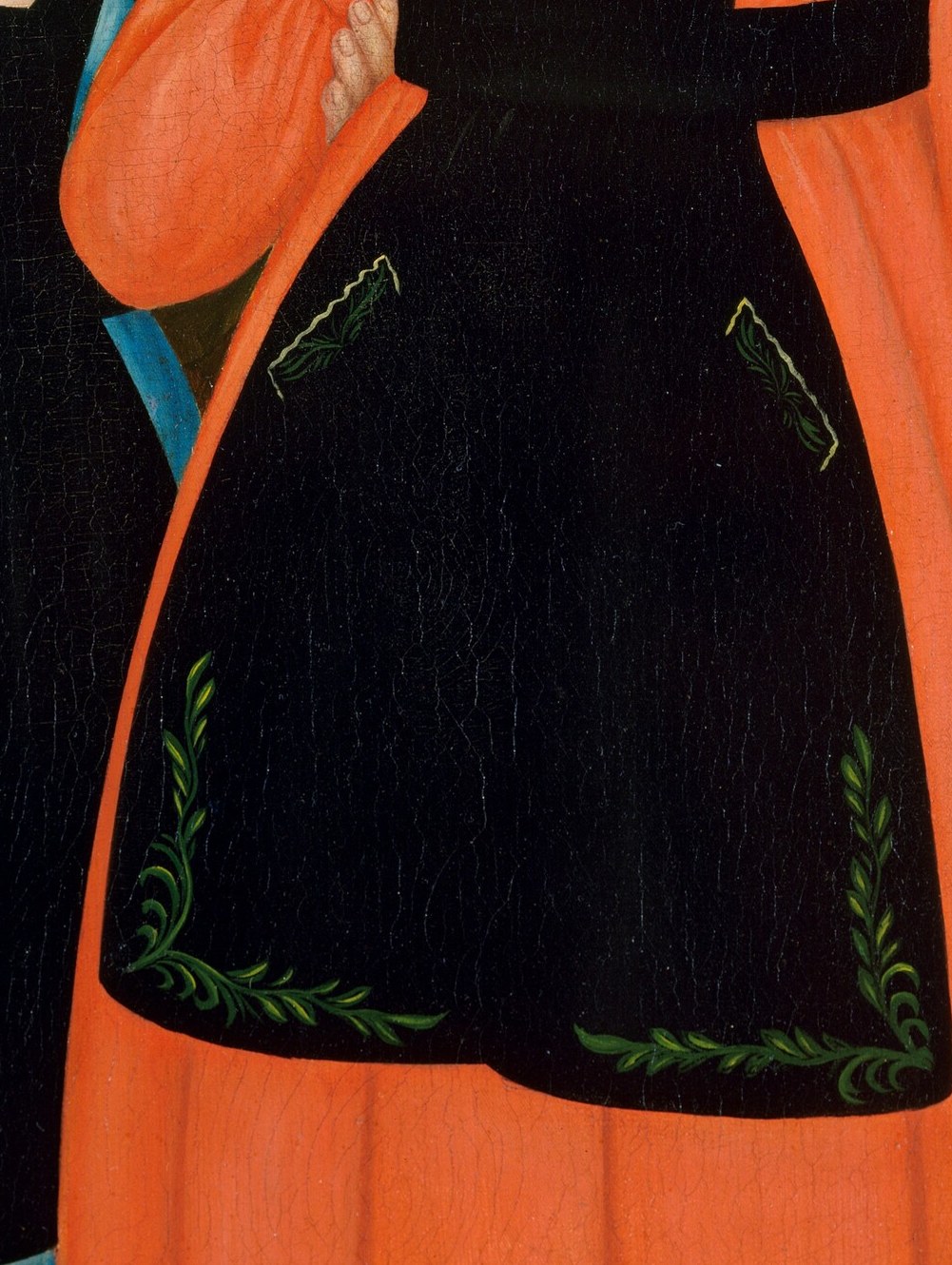 Look closely at the green vine pattern on her apron.