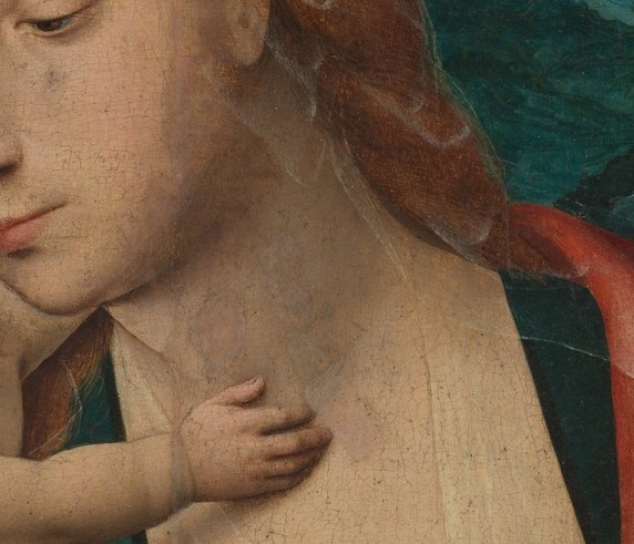 At her neckline, dark green: the color of earthly life and spring.