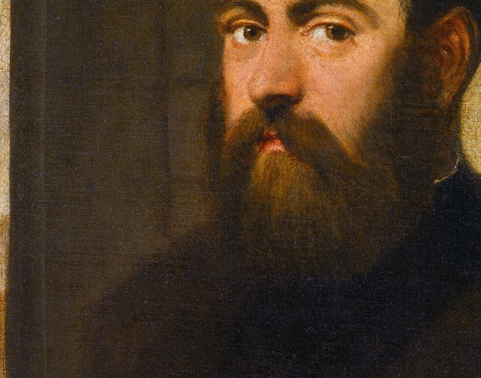This man’s meticulous beard and robe signal his status.