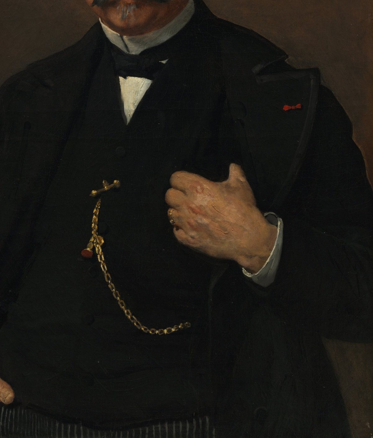 He wears the formal suit of a man of his standing.