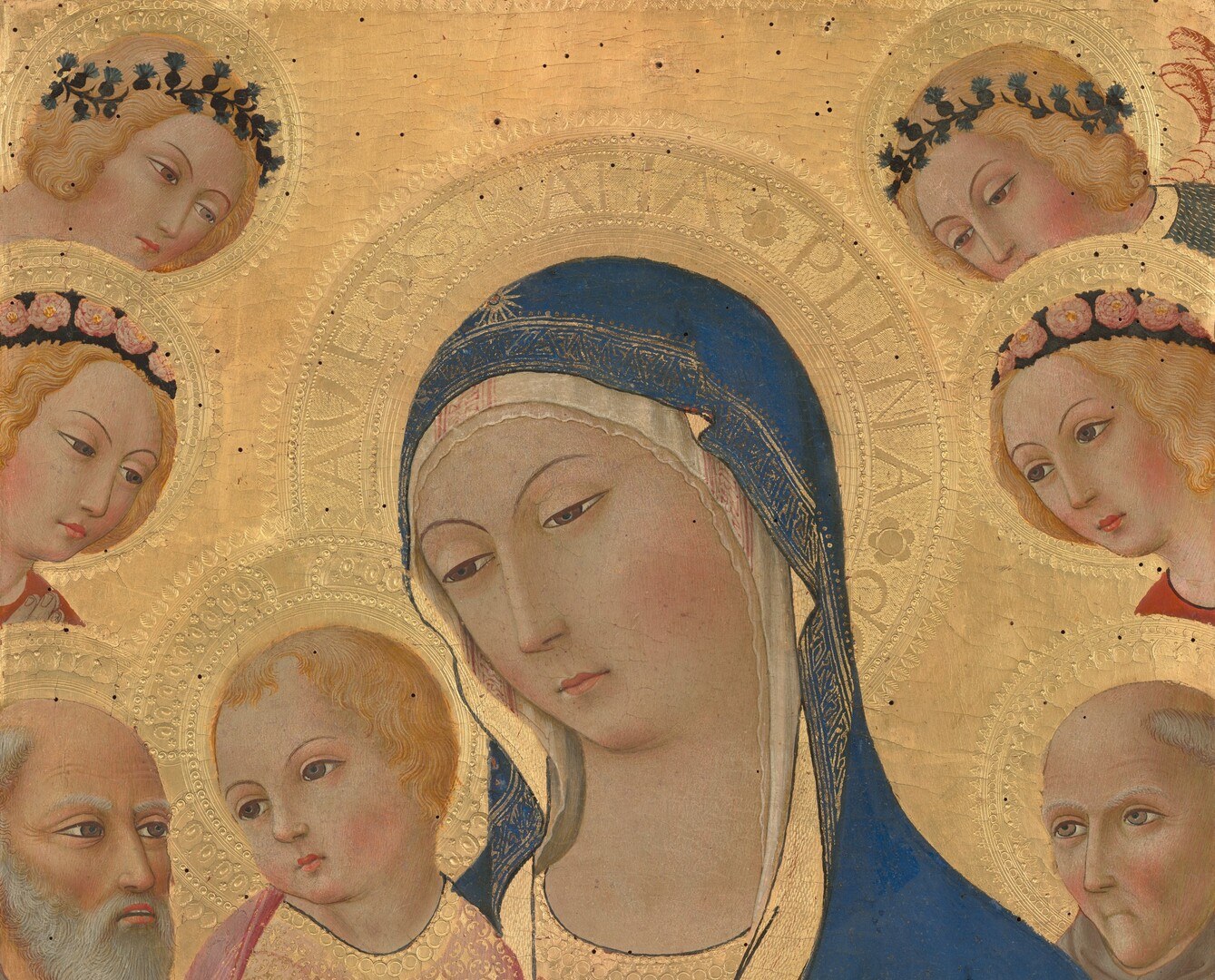 Applied gold leaf functions as sacred light rather than sky , tool marks, pastiglia relief, or punched star/flower motifs may survive in the upper zones and repay close-up scrutiny