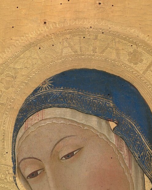 The calm oval face with lowered eyes is designed for prolonged devotional contemplation , Sano di Pietro's signature expression of tender detachment from the world