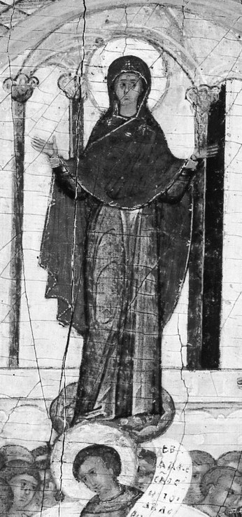 Her outstretched arms offer divine intercession and protection.