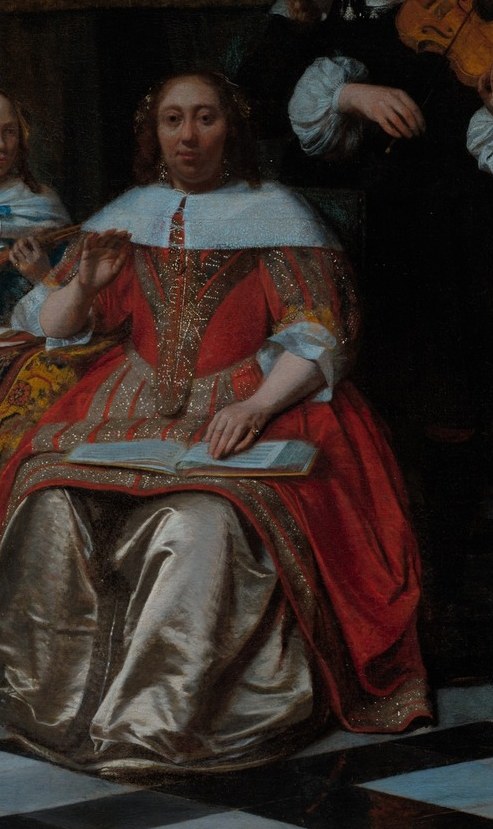 The woman in red leads the music.