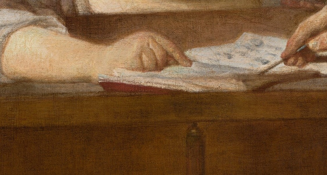 Her delicate fingers guide his pen.