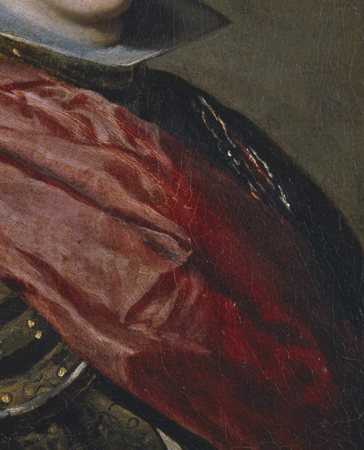 The red sash shows his royal status.