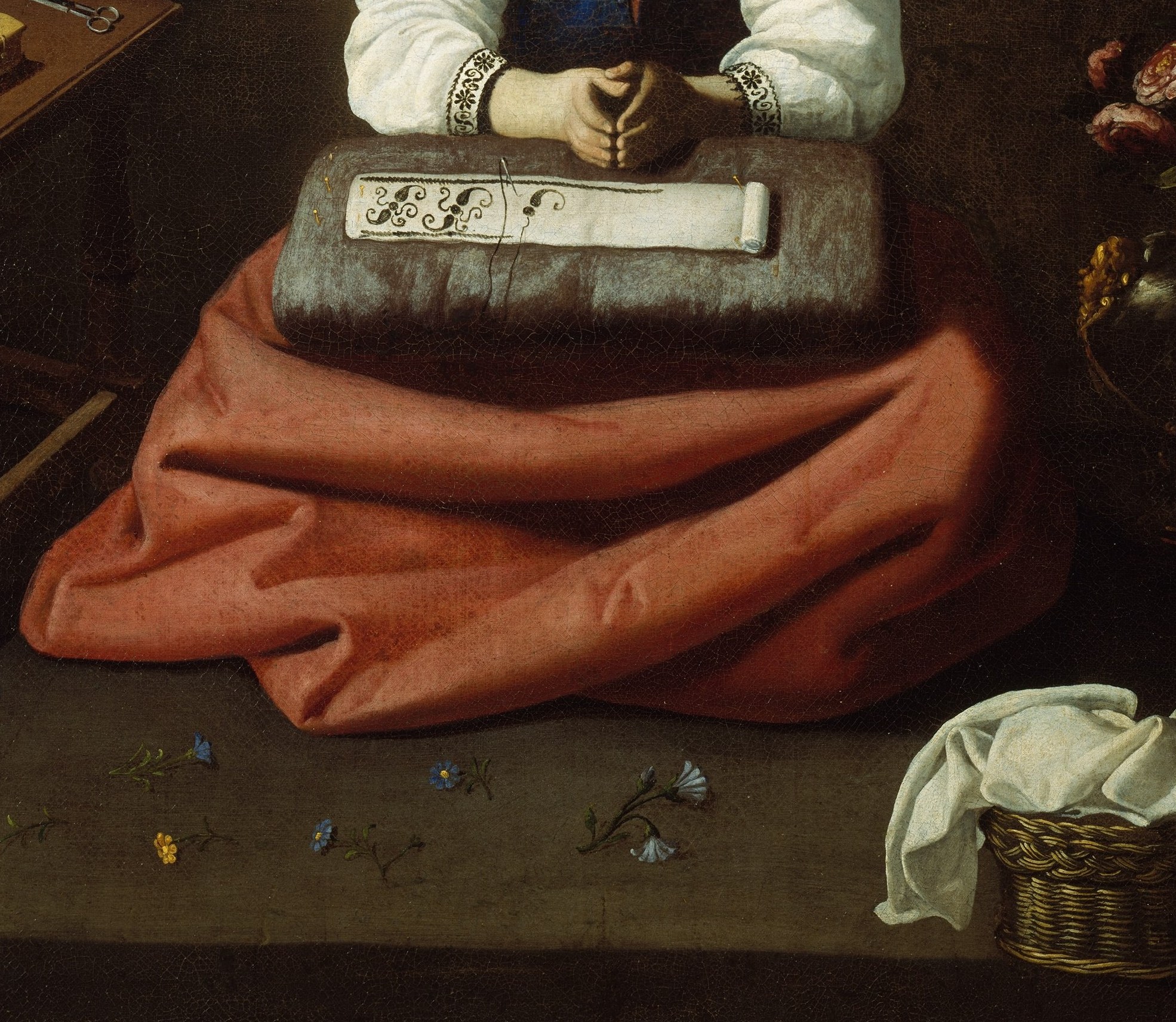 The vast warm red anchors the composition; its cloth folds display Zurbarán's extraordinary ability to render woven fabric