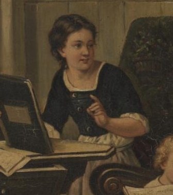 The girl studies sheet music intently.