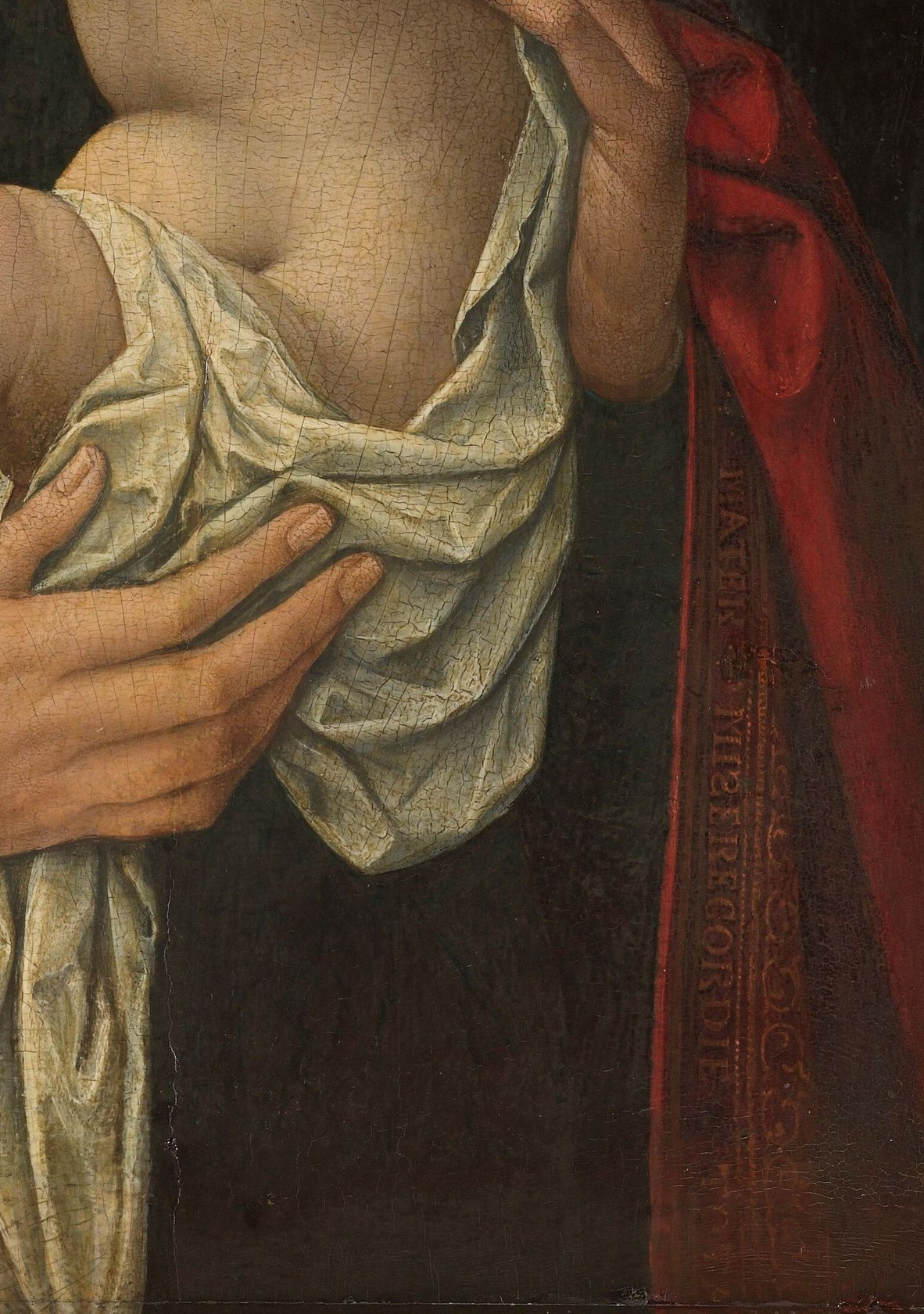 But look at the rich red fabric of her robe.
