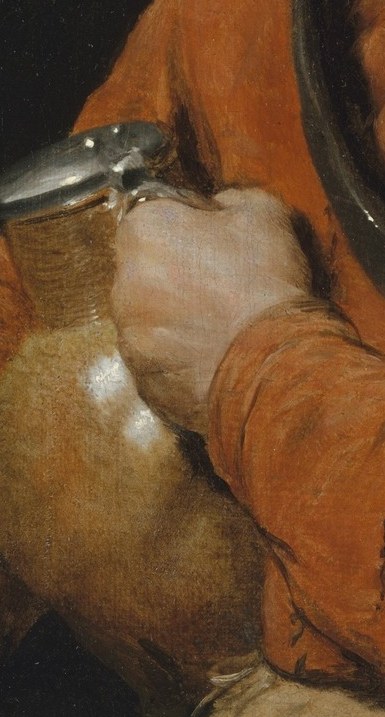 The reflective surface of the jug catches light, adding a dynamic element to the composition.