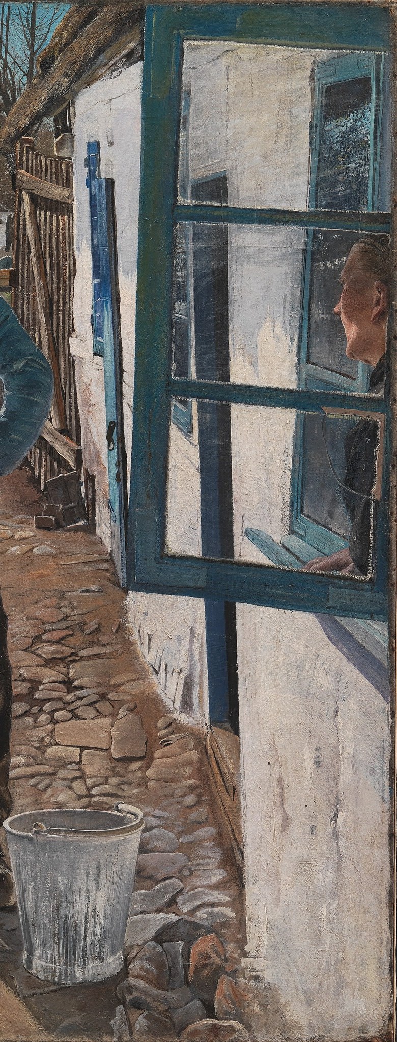 That vivid blue door anchors the edge of the fresh white wall.