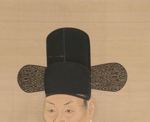 His official rank is clear from the elaborate winged hat.