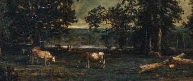 Scan the middle distance. Past the cattle, beneath the dark treeline.