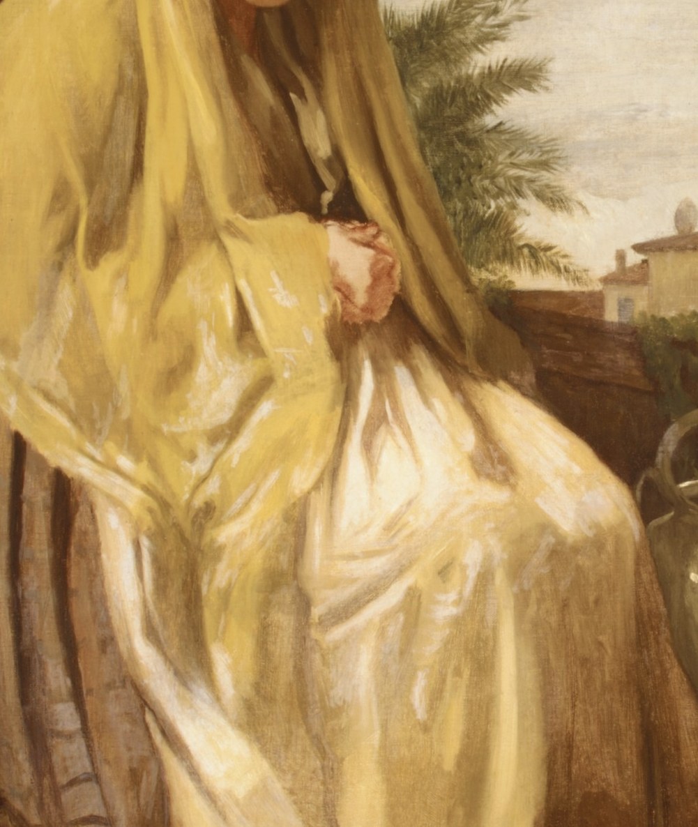 She wears a voluminous yellow shawl, enveloping her in quiet contemplation.