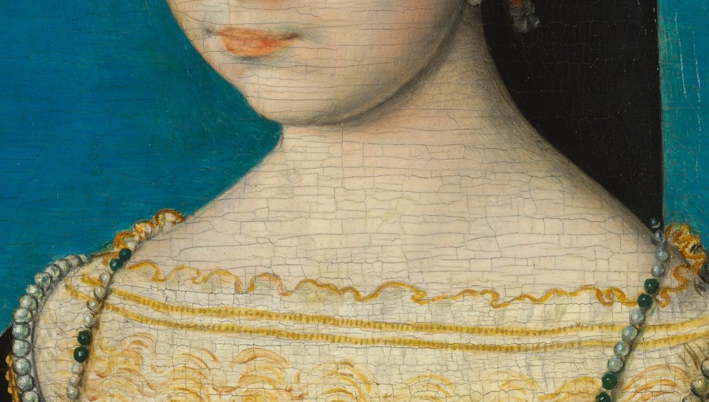Fine cracks, called craquelure, show the paint's true age.