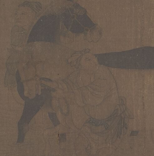 The horse lifts its hoof, cooperating with the washing.
