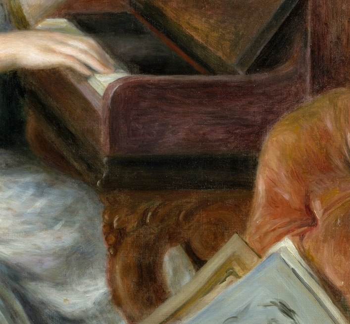 The rich, dark wood provides a grounding contrast to the lighter figures and fabrics.