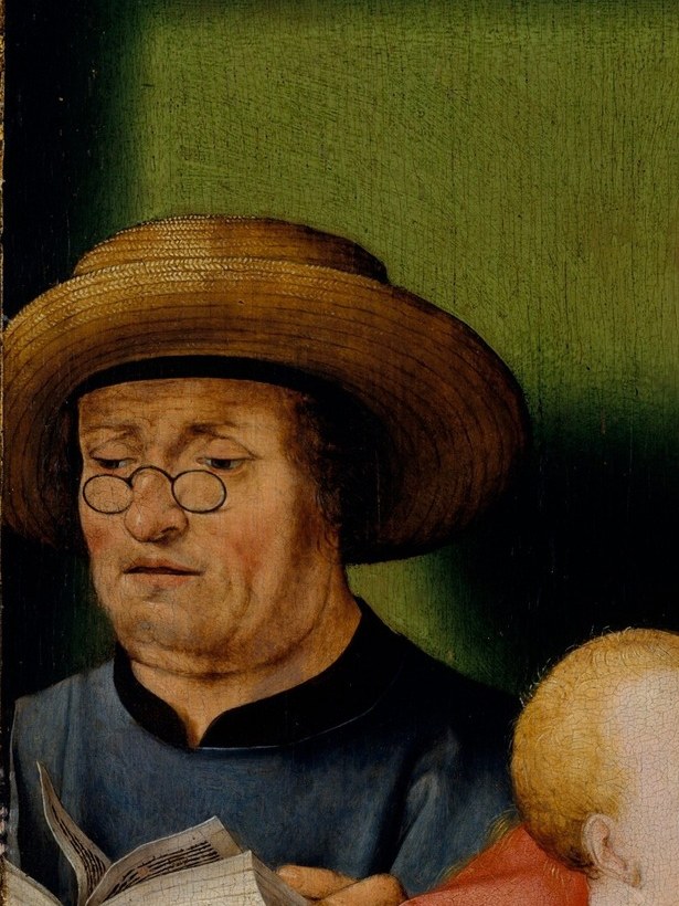Older, ruddy features contrast with Mary's youth; spectacles or eyeglasses on his face are a Netherlandish detail rarely seen in Italian treatments.