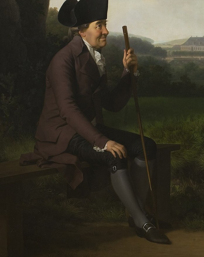 His posture and gaze suggest contemplation or perhaps a moment of rest, conveying a sense of gravitas.