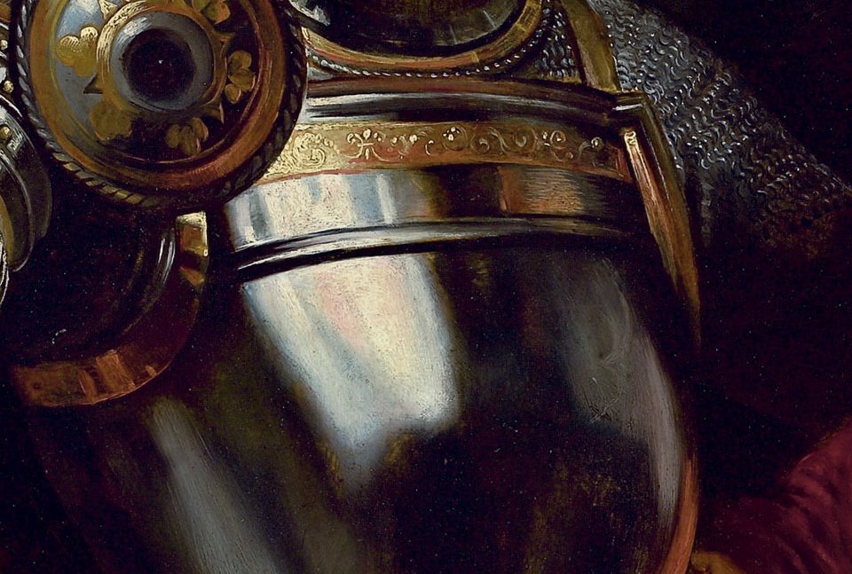 The etched motifs on the breastplate are heraldic, a family crest.