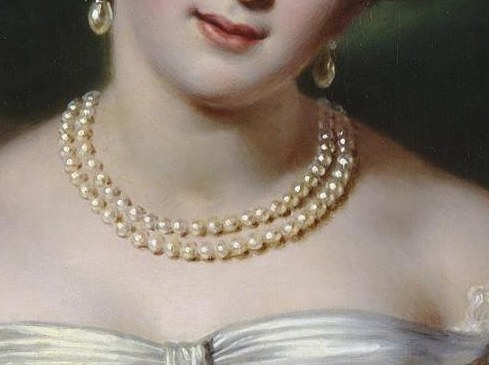 The double-strand pearl necklace speaks of her wealth and status.