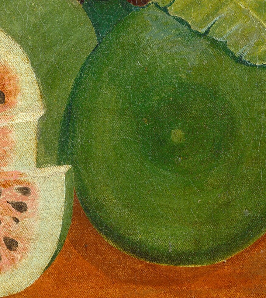 Its smooth, dark green surface provides a solid, grounding element in the composition and hints at a hidden interior.