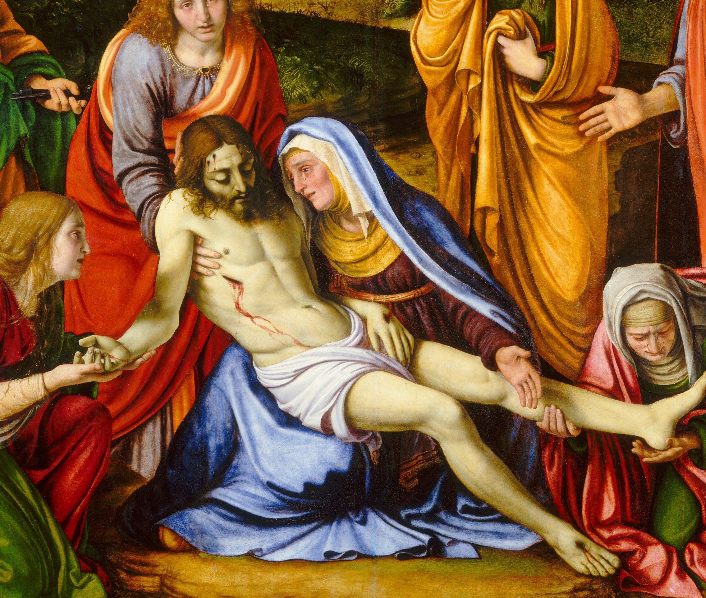 The pale, limp torso anchors the entire composition; the wound in the side and the slackness of the limbs make death undeniably physical rather than symbolic.