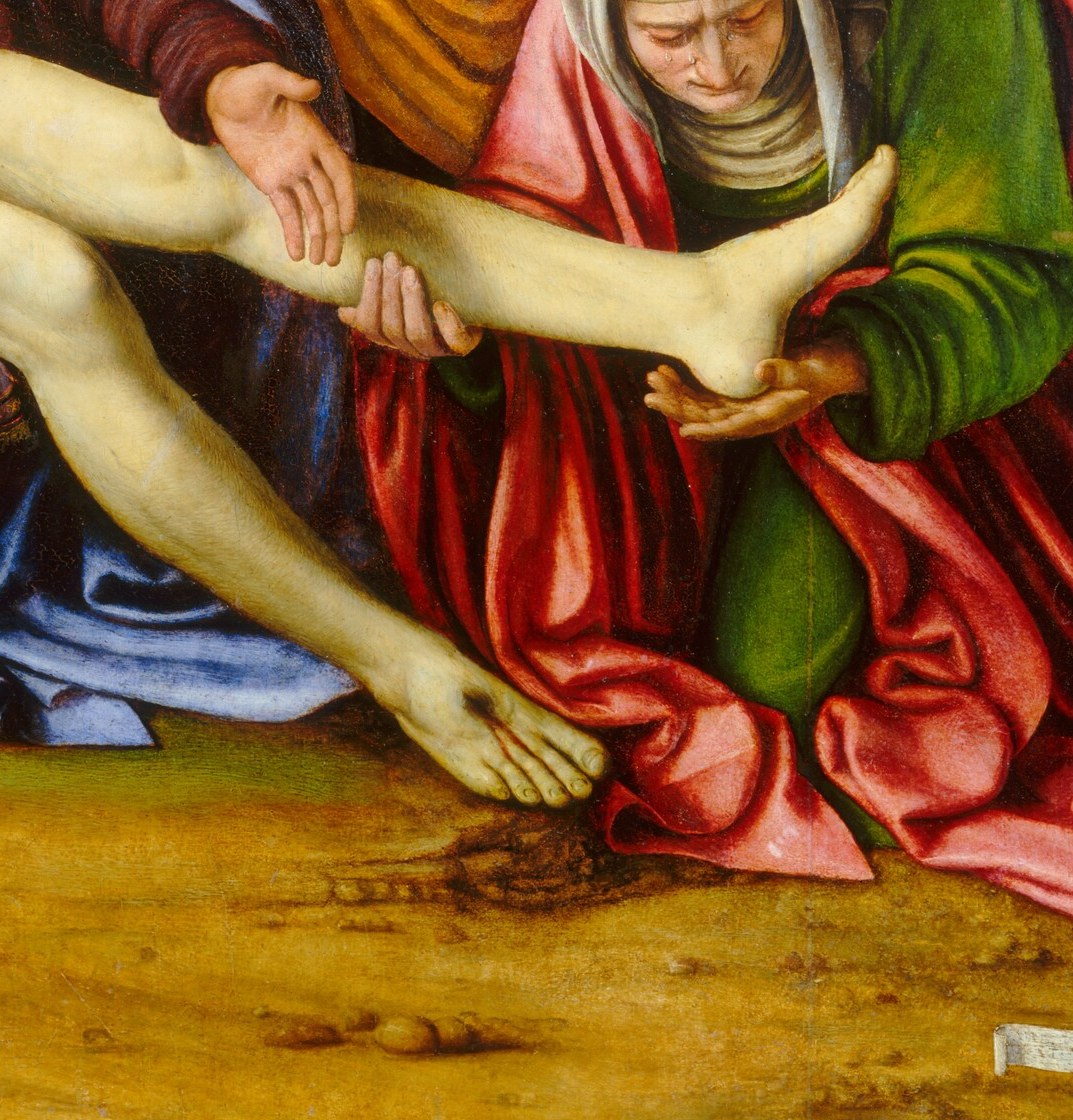 A seated mourner cradles the feet, echoing the Pietà tradition; the soles are rendered with striking anatomical specificity , a favourite close-up detail for meditation.