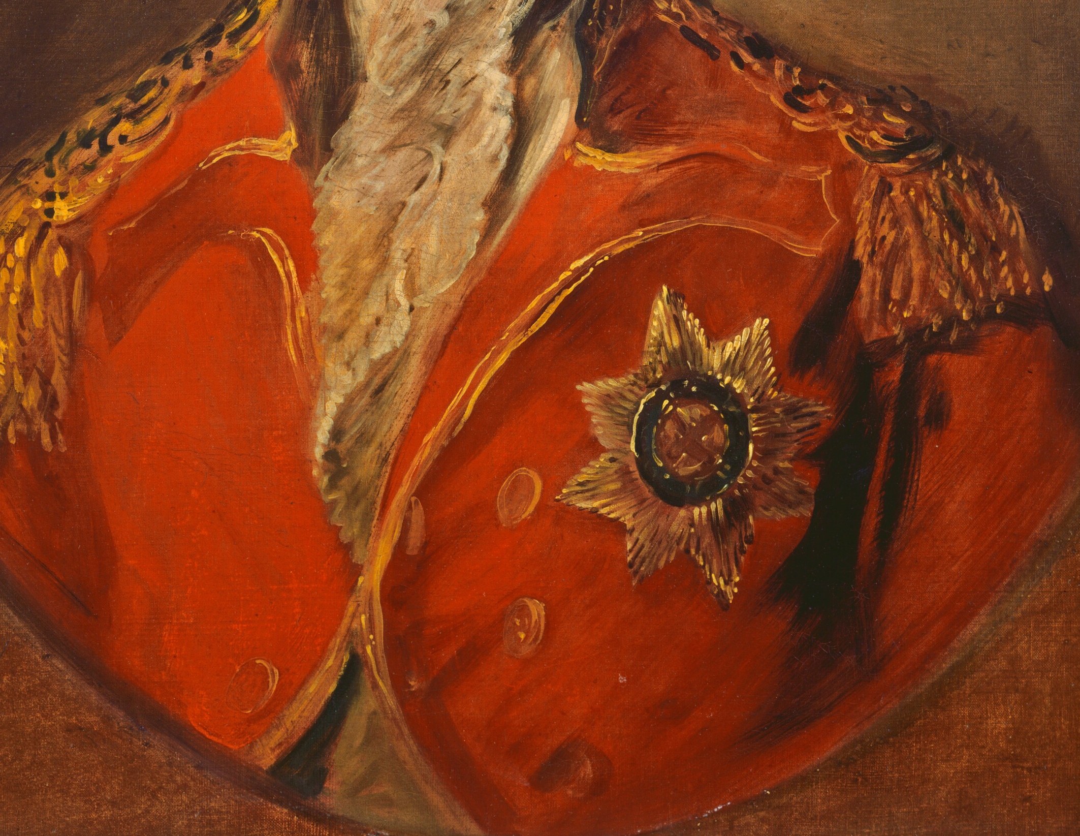 He wears a military jacket, finely adorned with gold embroidery.