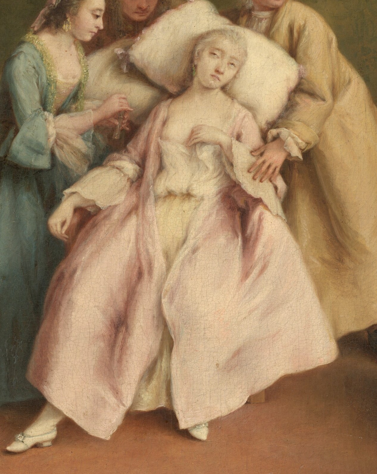 A woman has fainted, surrounded by concerned faces.
