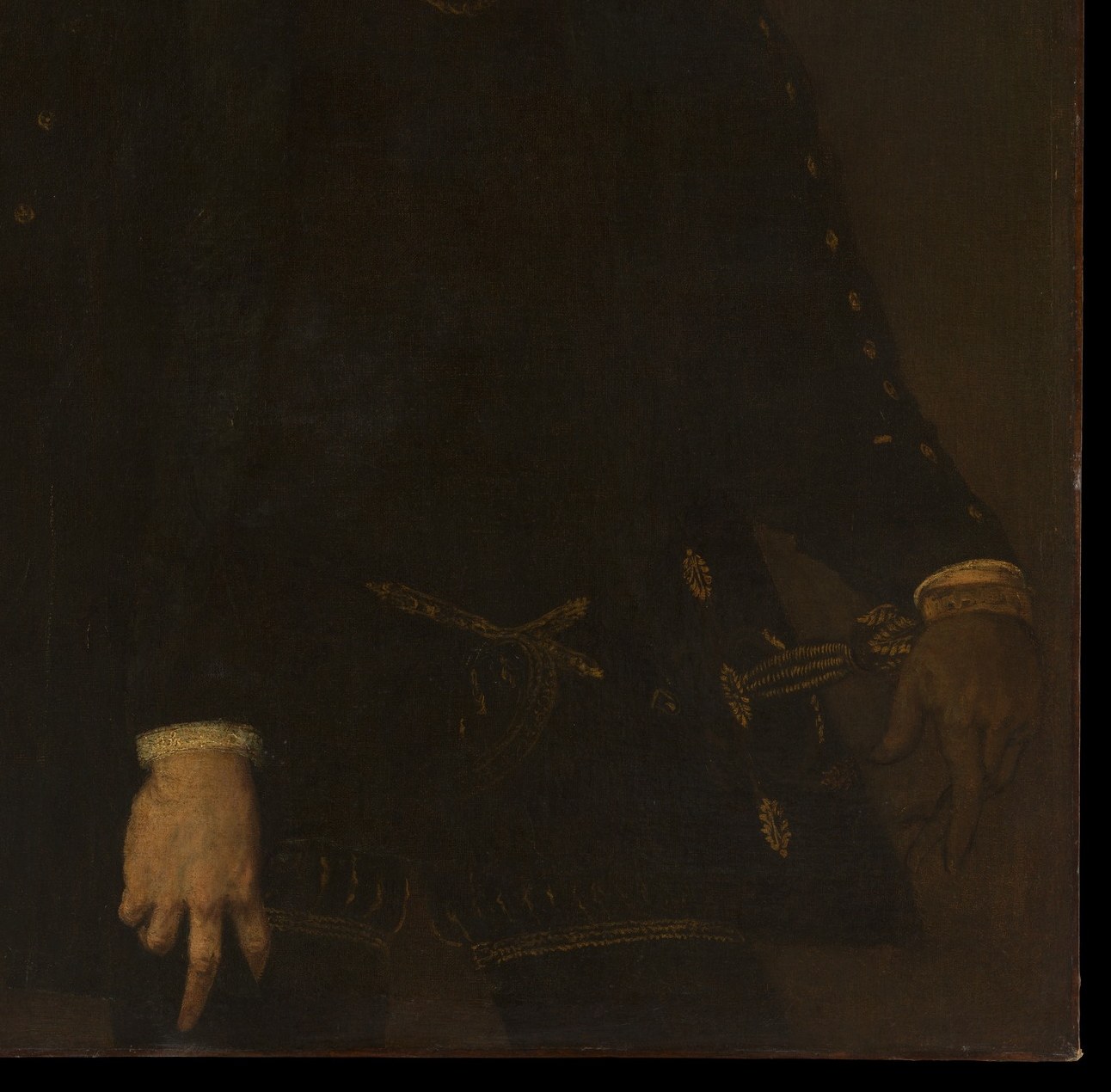 Notice the detailed embroidery on his rich dark jacket.