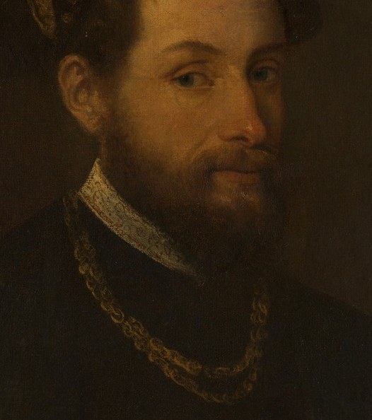 His direct gaze and slight smile suggest confidence and perhaps a hint of amusement.