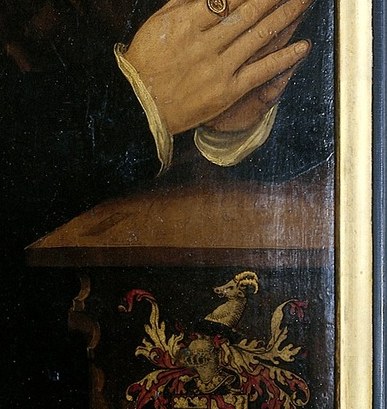 The rendering of his hands, with a ring on his finger, shows careful attention to detail and devotional posture.