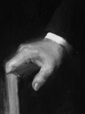 Notice how his right hand rests firmly on an unseen object.