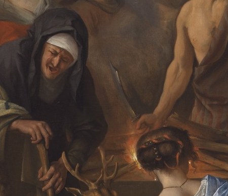 Look closer at the old woman tending the fire.