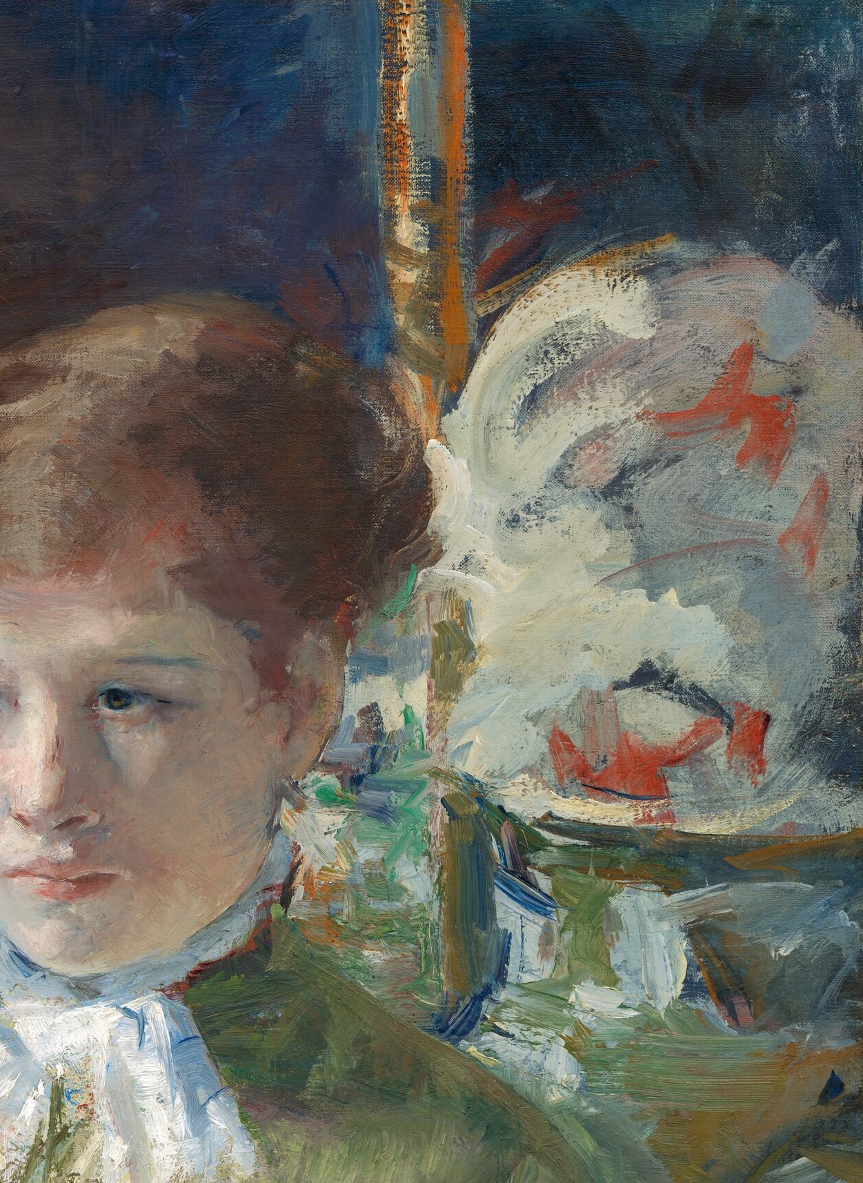 A blurred second figure is just visible.