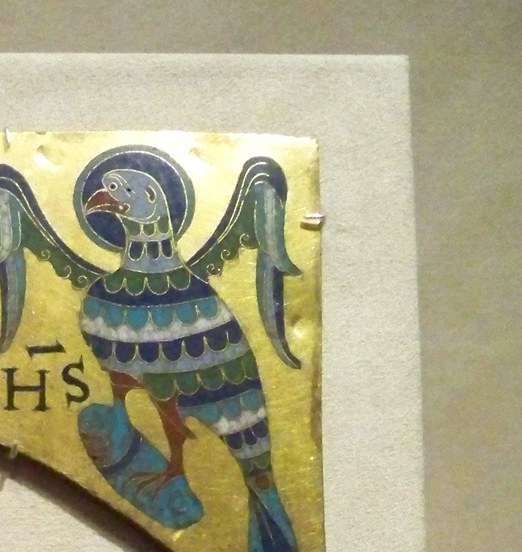 The OHS abbreviation is a compressed form of IOHANNES , Romanesque craftsmen encoded scripture in shorthand that literate clerics would instantly read