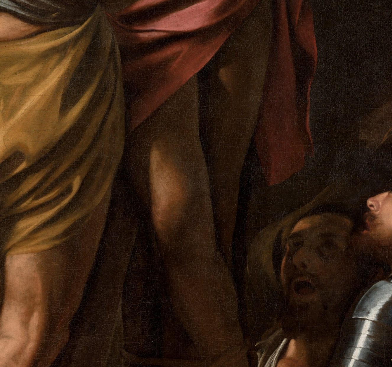 The only warm color in a cool, dark palette; Caravaggio uses it as a compositional anchor and a thread of human dignity connecting the luminous torso to the shadowed crowd below.