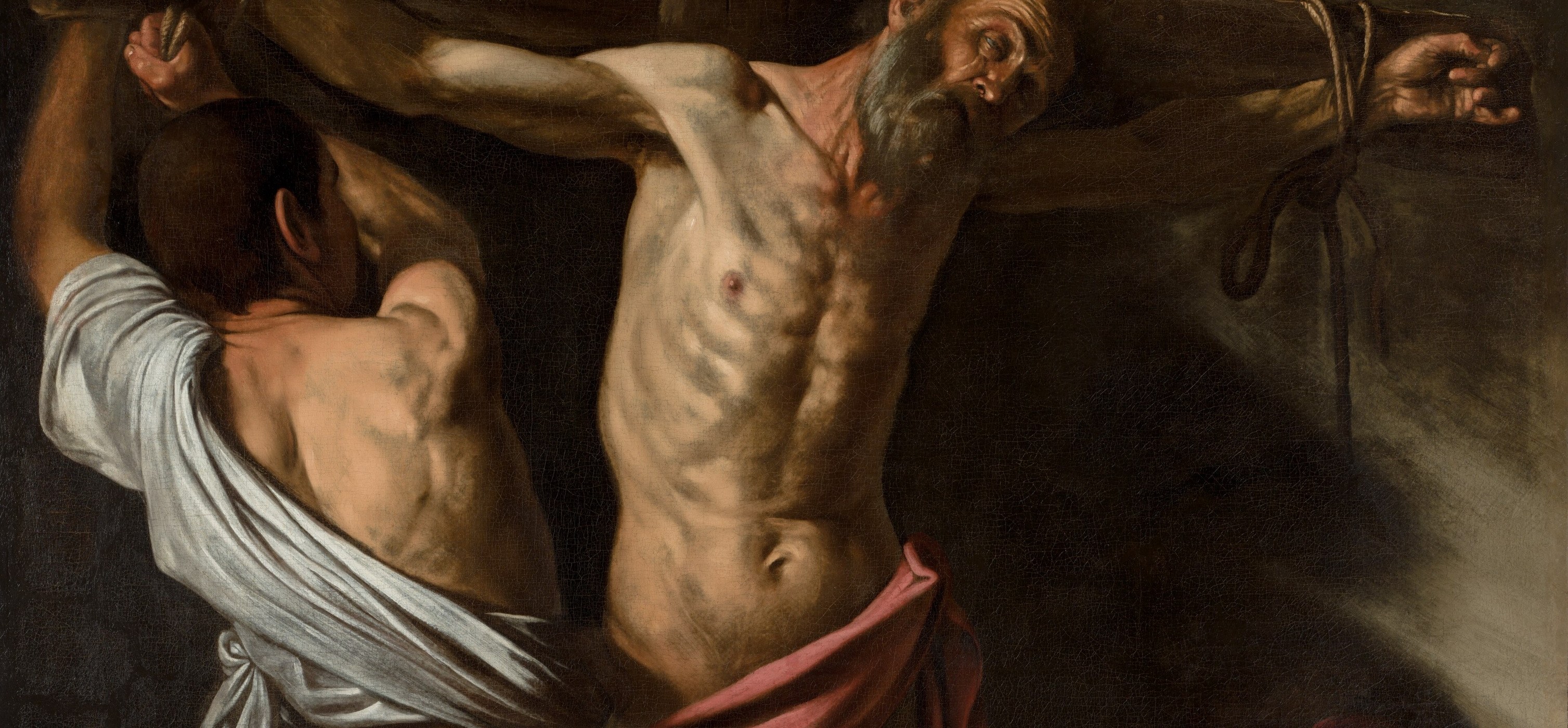 The arms span nearly the full painting width, fusing body and cross into a single shape , the saint does not hang on the cross, he becomes it.