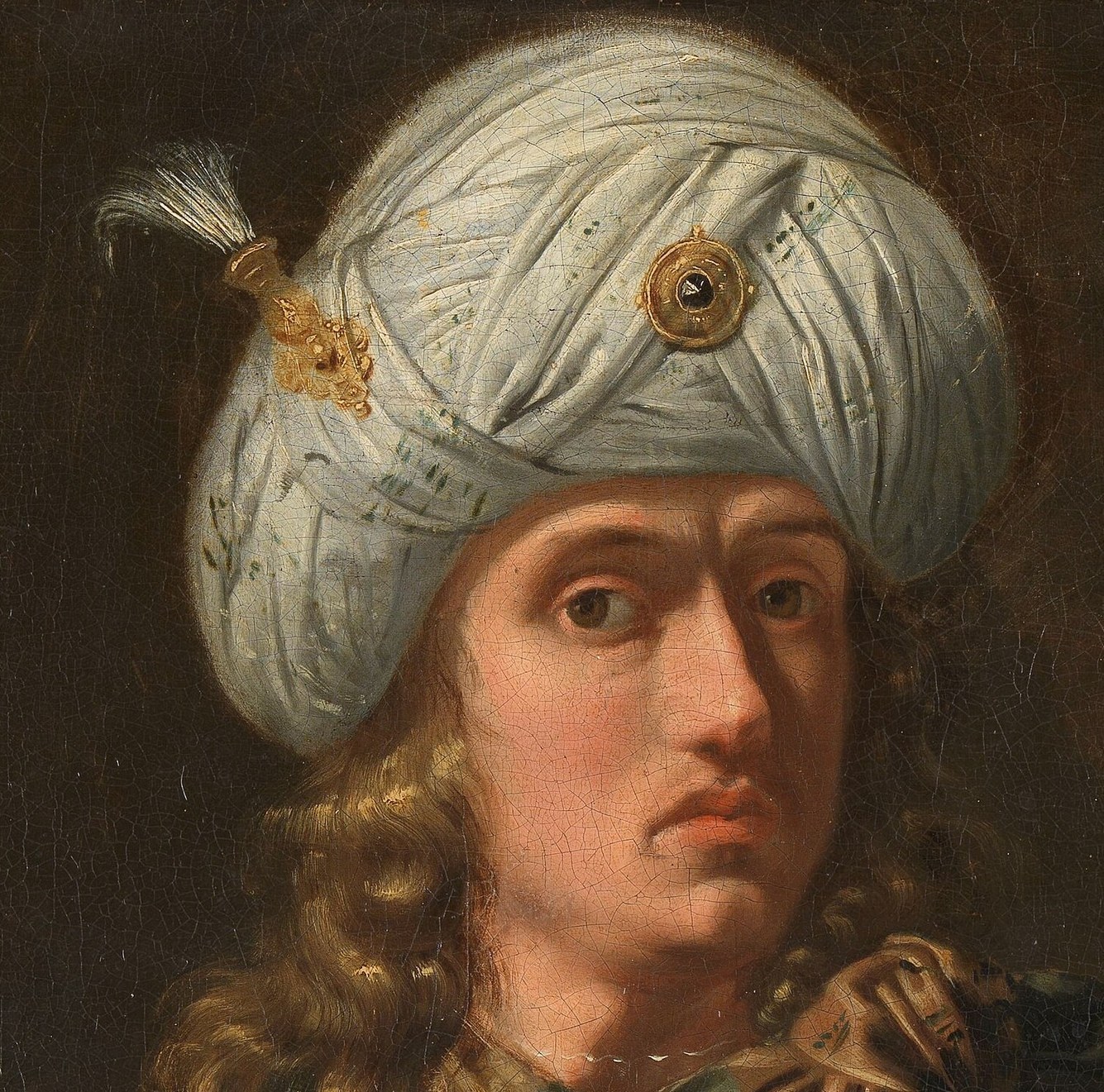 The elaborate folds and jeweled ornament indicate status and exoticism.