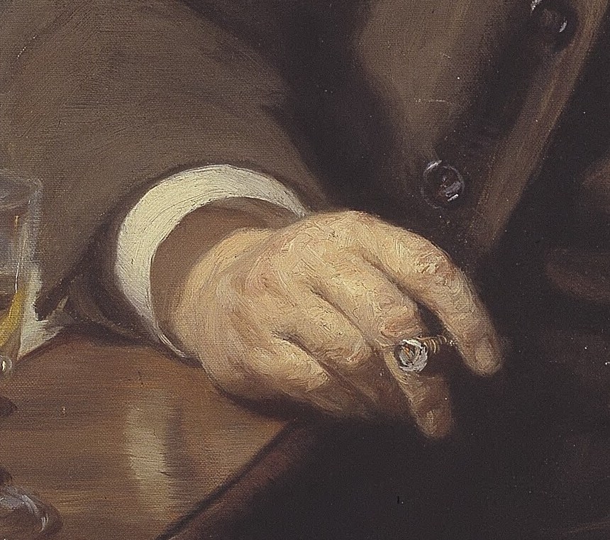 The relaxed pose of his hand suggests ease and contemplation, with the ring adding a personal detail.